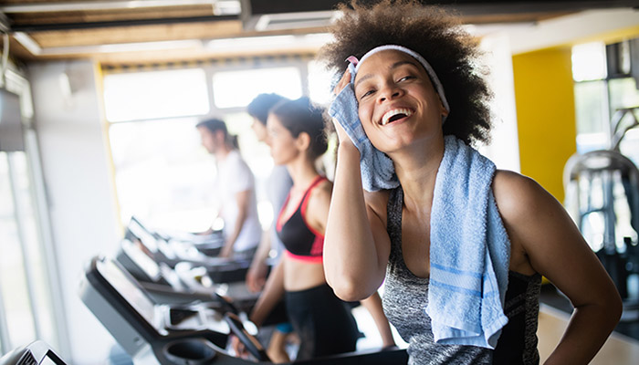 Group of healthy fit people at the gym exercising